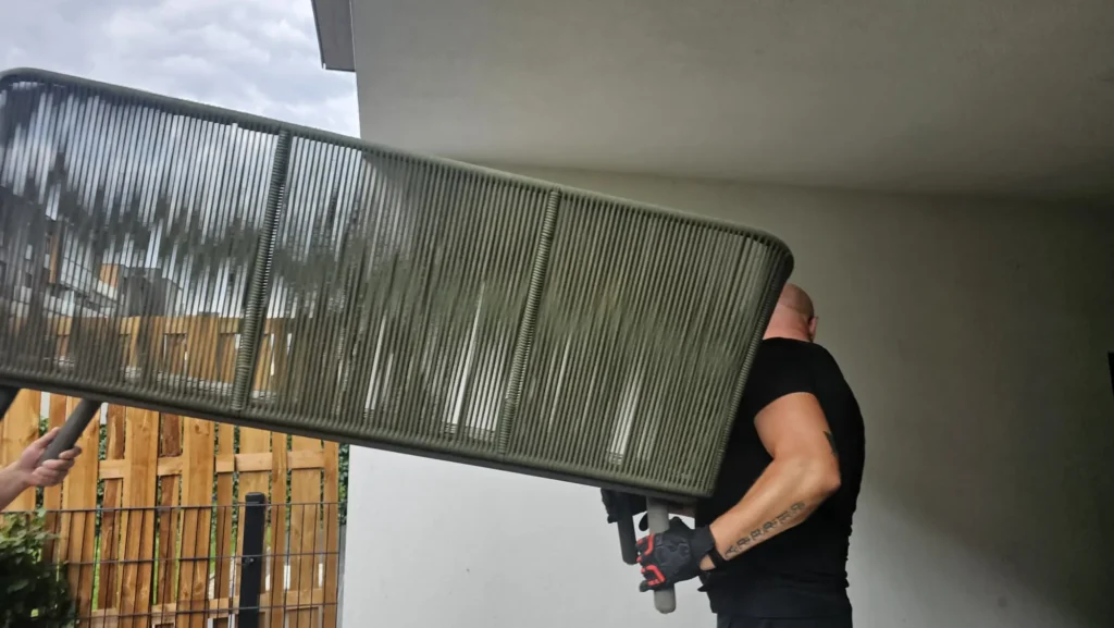 Furniture being carried during a removal to Italy