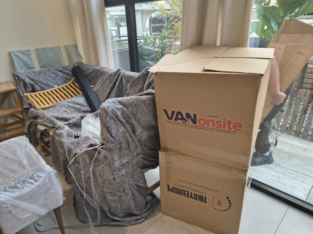 Packed furniture and moving boxes for a removal to Italy